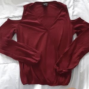 Ribbed red long-sleeve top with shoulder cutouts